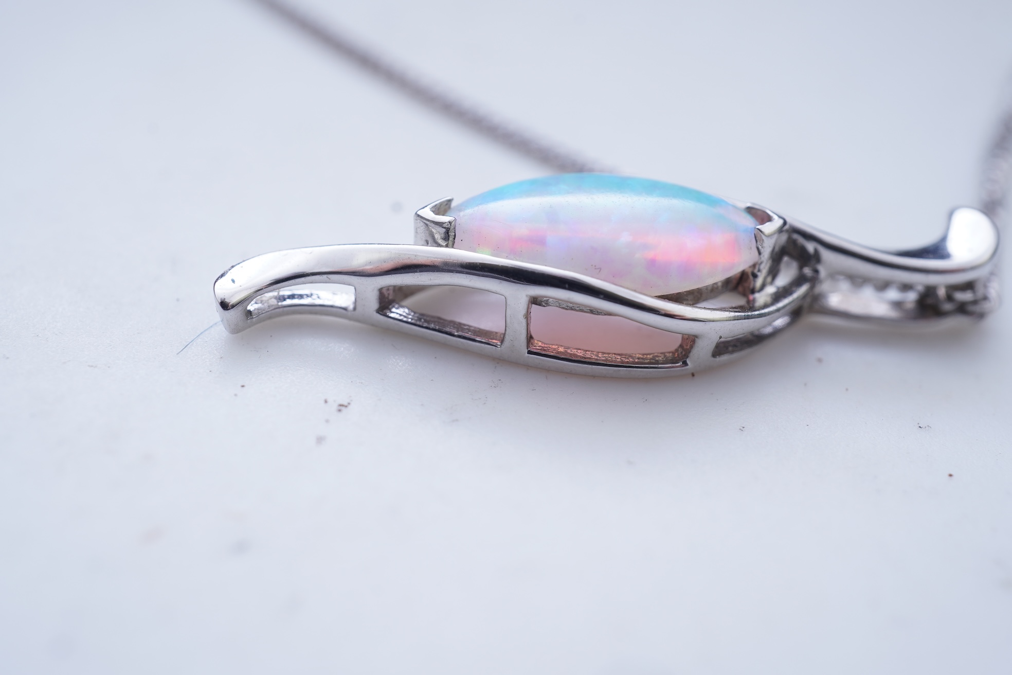 A synthetic opal demi-parure